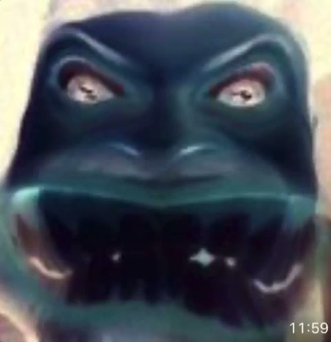 Bluberto Fartolini, a furious blue gremlin face with many teeth